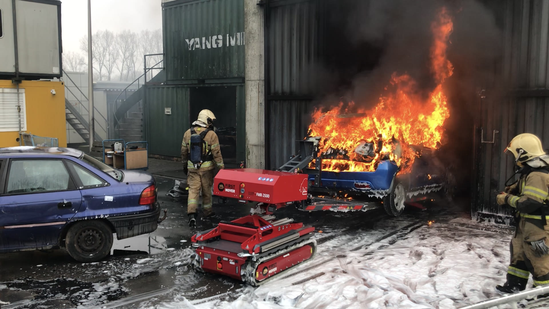 First-Mover FMR-3500 extracting a burning vehicle with firefighters